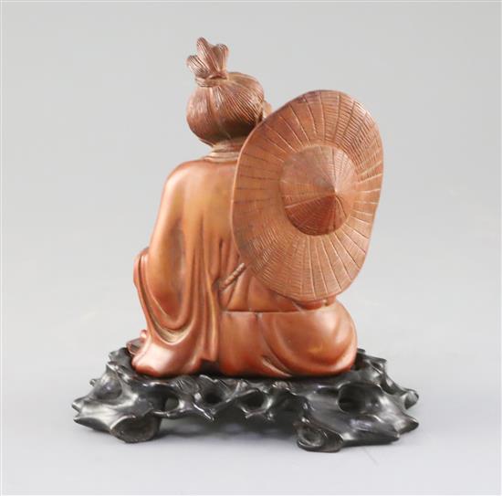 A Chinese boxwood seated figure of a fisherman, with hongmu stand, c.1900, H.15cm